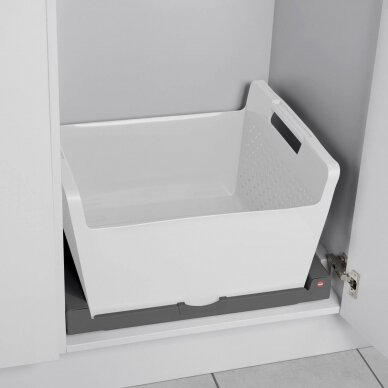 Pull-out shelf with plastic basket for laundry